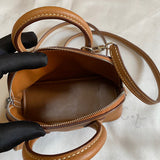 Side view of minimalist structured handbag