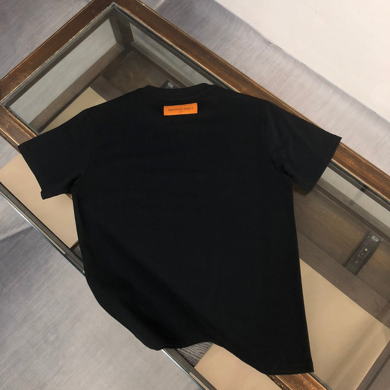 Close-up detail shot of Louis Vuitton cotton t-shirt with label-forward styling
