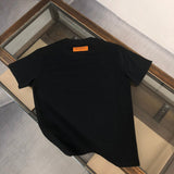 Close-up detail shot of Louis Vuitton cotton t-shirt with label-forward styling