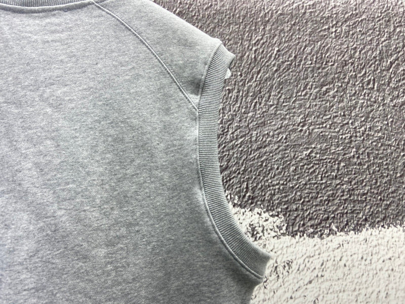 Side profile of Louis Vuitton luxury clothing with logo-detail design