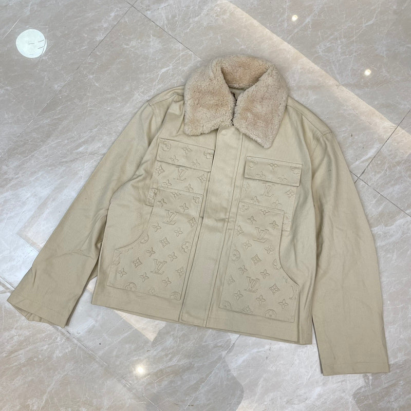 Close-up detail shot of Louis Vuitton luxury clothing with monogram-inspired silhouette