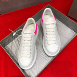 Side profile of Alexander McQueen fresh white-and-black sneakers streetwear statement look