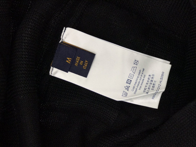 Side profile of Louis Vuitton luxury clothing with signature branding