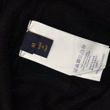 Side profile of Louis Vuitton luxury clothing with signature branding