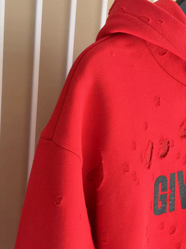 Close-up detail shot of Givenchy luxury clothing with logo-detail design