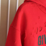 Close-up detail shot of Givenchy luxury clothing with logo-detail design
