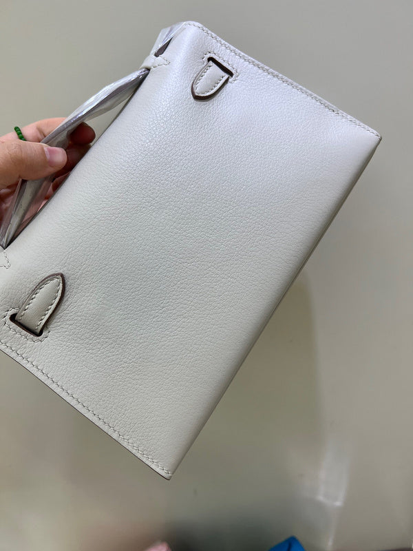 Side view of streamlined structured handbag