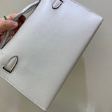 Side view of streamlined structured handbag