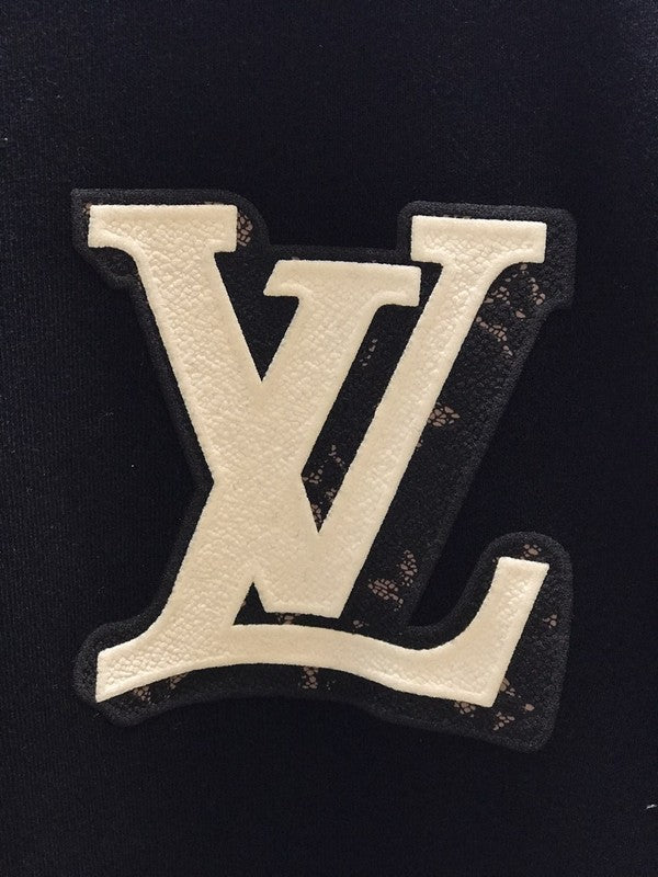 Flat lay presentation of Louis Vuitton luxury clothing with streetwear-inspired cut