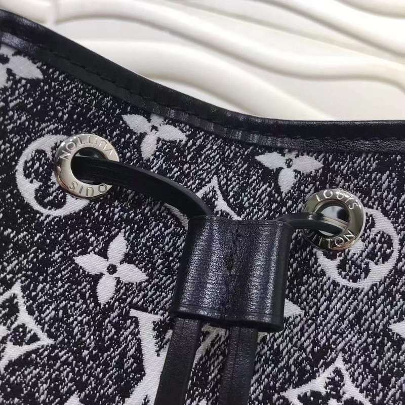 Handle and strap detail of elevated signature women's handbag – women's statement bag