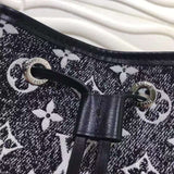 Handle and strap detail of elevated signature women's handbag – women's statement bag