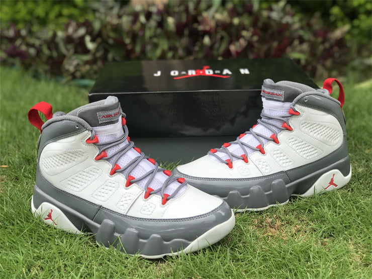 Side profile of Nike soft grey sneakers bold athletic profile