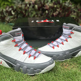 Side profile of Nike soft grey sneakers bold athletic profile