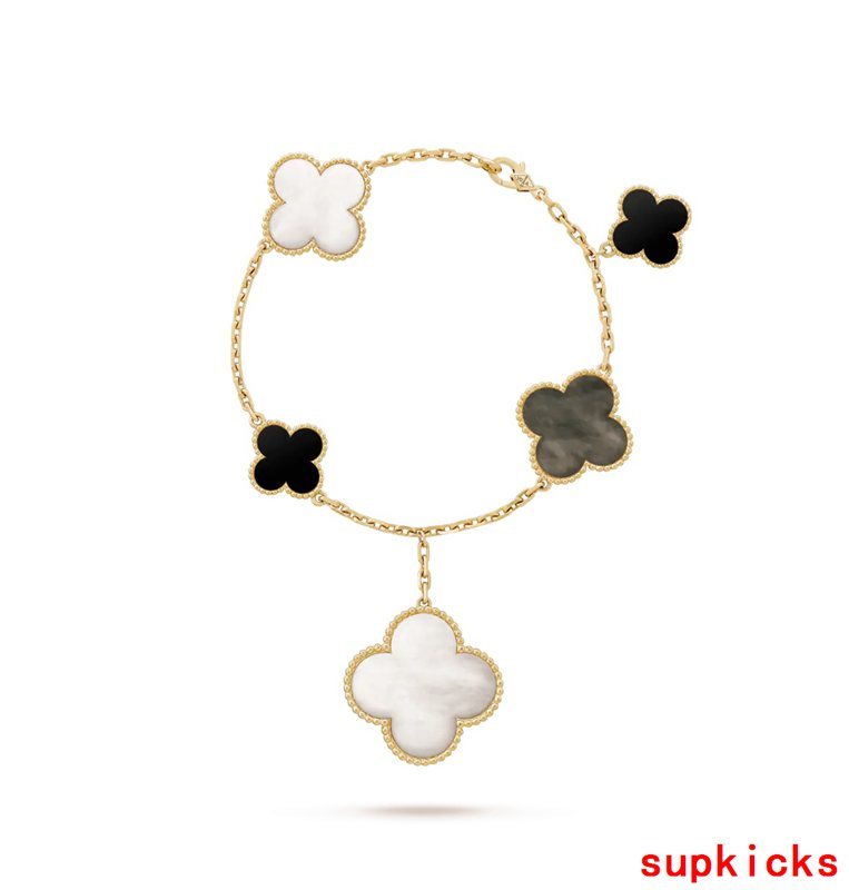 Lifestyle view of Van Cleef & Arpels unisex jewelry piece