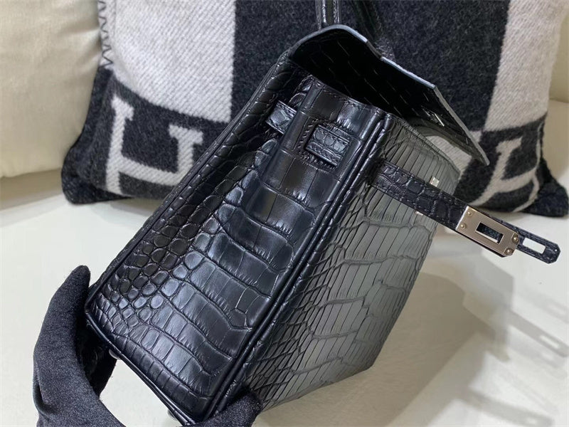 Side view of streamlined structured handbag