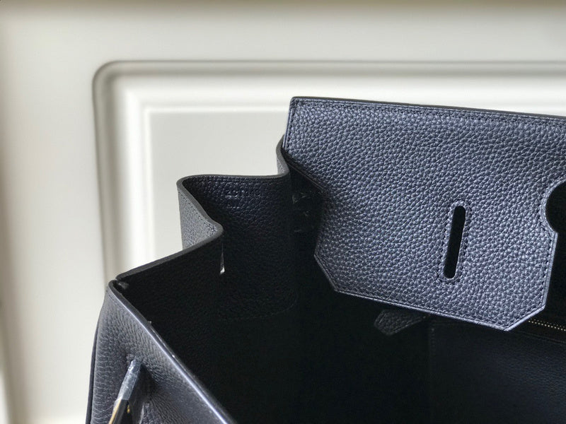 Side view of structured structured handbag