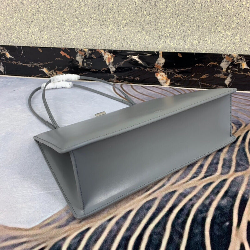 Styled lifestyle shot of elevated polished women's handbag – women's statement bag