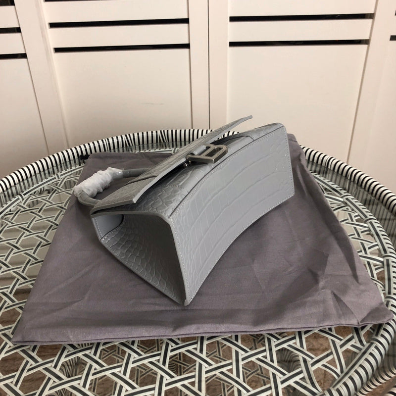 Styled lifestyle shot of sleek classic women's handbag – women's designer-style accessory