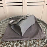 Styled lifestyle shot of sleek classic women's handbag – women's designer-style accessory