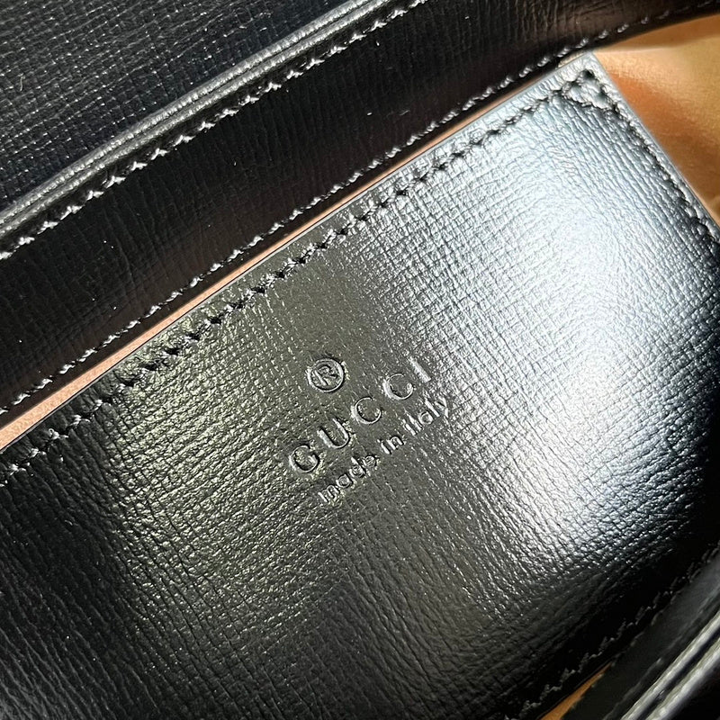 Side profile of elevated statement women's handbag – women's luxury accessory