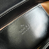 Side profile of elevated statement women's handbag – women's luxury accessory