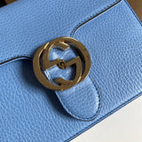 Back view of sleek structured women's handbag – women's statement bag