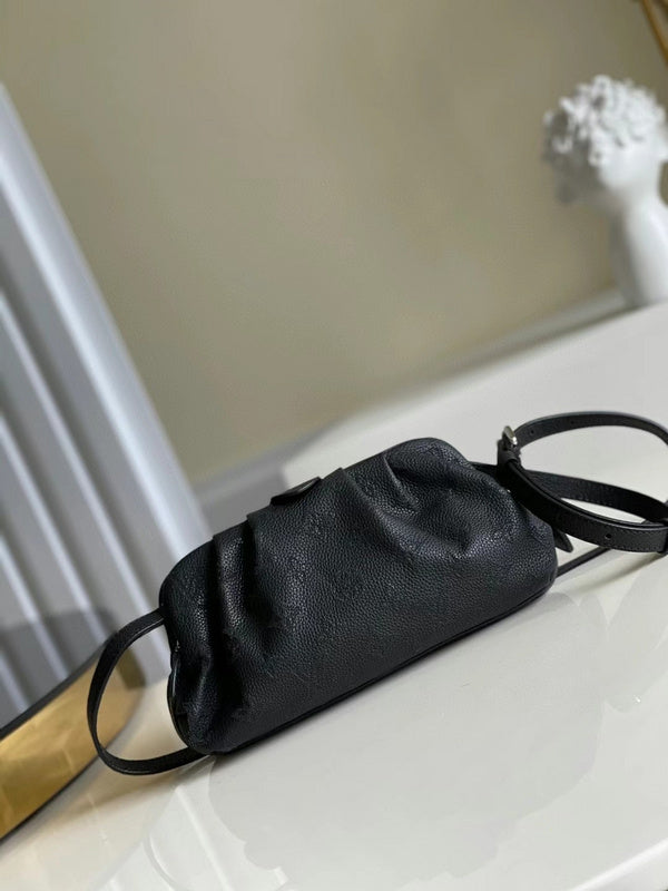 Side profile of structured everyday-luxe women's handbag – women's designer-style accessory