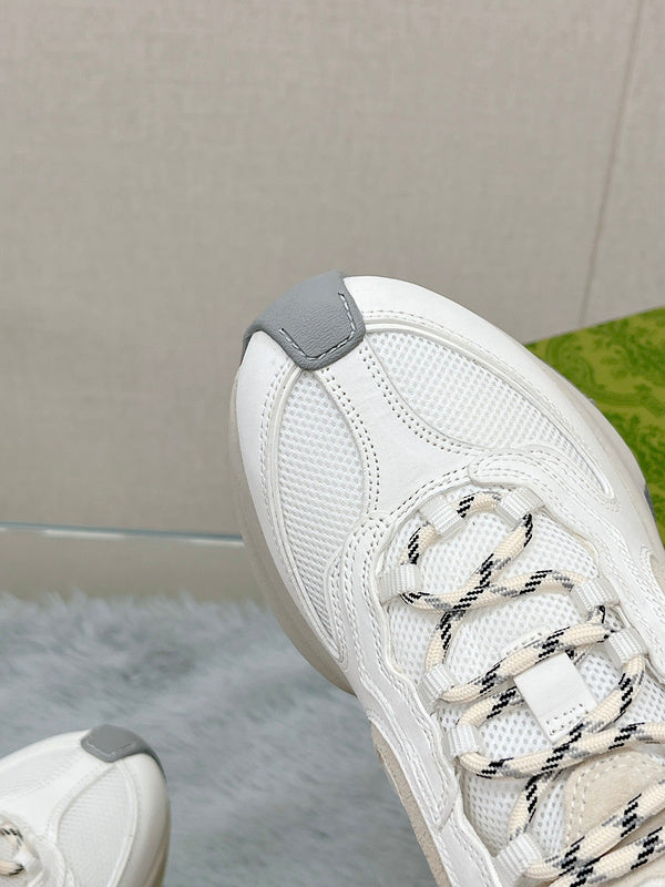 Side profile of Gucci muted earth tones sneakers retro runner design