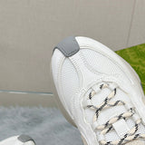 Side profile of Gucci muted earth tones sneakers retro runner design