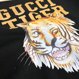Flat lay presentation of Gucci luxury clothing with relaxed-fit cut