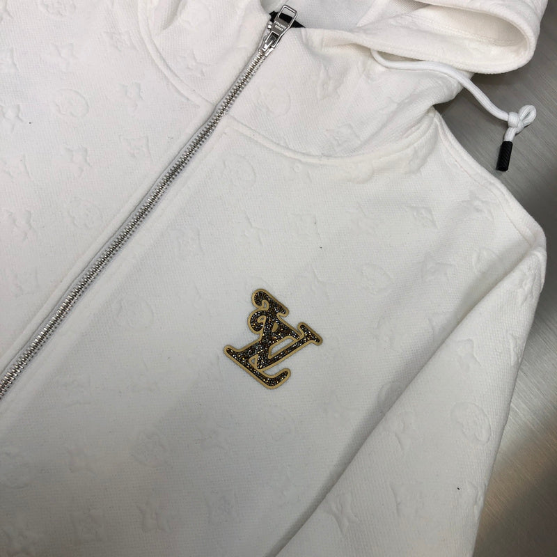 Full styled look of Louis Vuitton luxury clothing with monogram-inspired silhouette