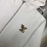 Full styled look of Louis Vuitton luxury clothing with monogram-inspired silhouette
