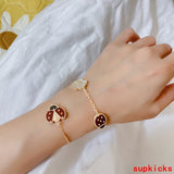 Side view of Van Cleef & Arpels unisex jewelry piece