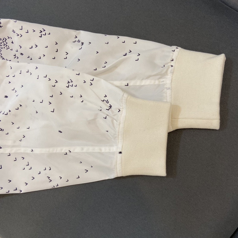 Close-up detail shot of Louis Vuitton luxury clothing with streetwear-inspired cut