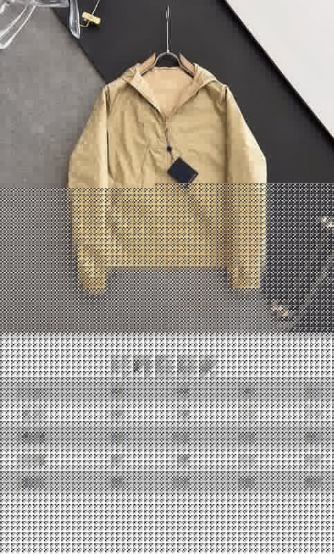 Close-up detail shot of Louis Vuitton luxury clothing with tailored silhouette