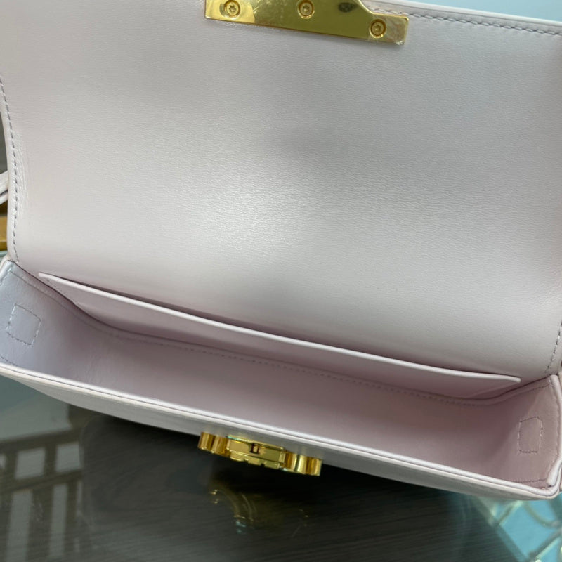 Back view of classic signature women's handbag – women's designer-style accessory