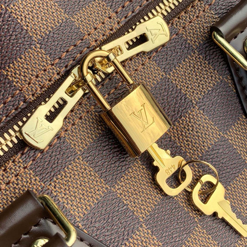 Side profile of polished signature women's handbag – women's luxury handbag