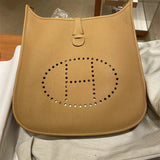  structured top-handle bag styled with outfit 18
