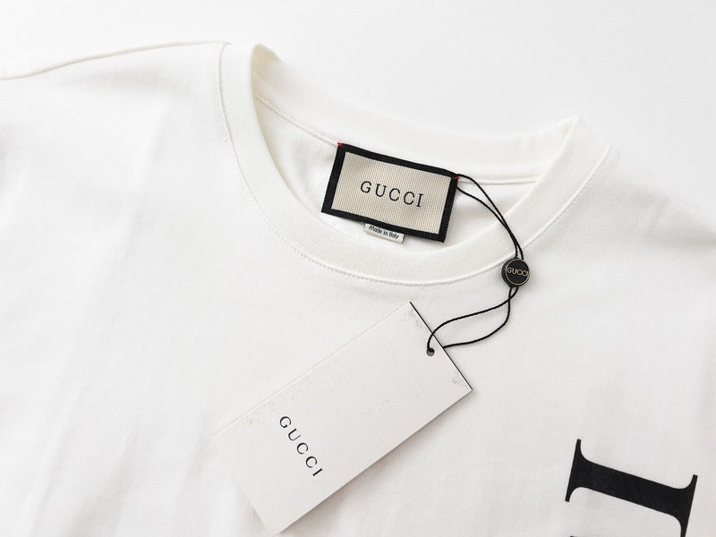 Flat lay presentation of Gucci luxury clothing with runway-inspired design