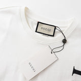Flat lay presentation of Gucci luxury clothing with runway-inspired design