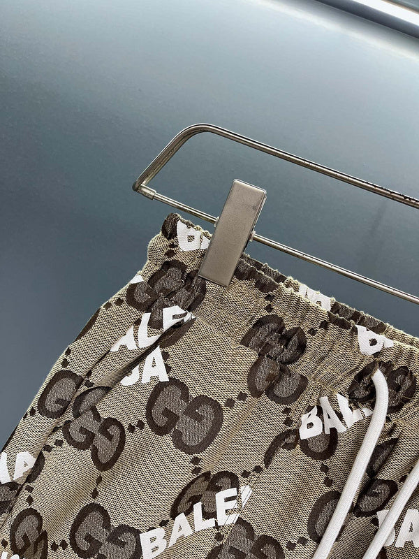 Full styled look of Gucci luxury clothing with monogram-inspired silhouette
