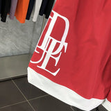 Front view of Rhude luxury clothing with label-forward styling
