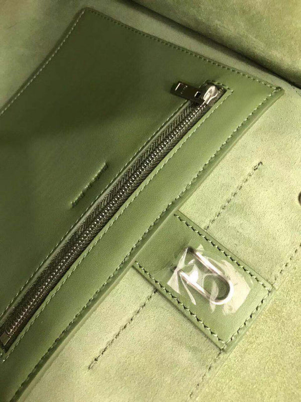 Side profile of refined modern women's handbag – women's statement bag