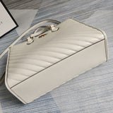 Handle and strap detail of chic sleek women's handbag – women's statement bag