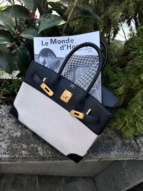 Side view of streamlined structured handbag