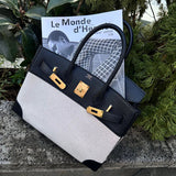 Side view of streamlined structured handbag
