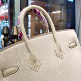 Side view of elegant structured handbag