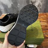 Side profile of Gucci crisp white sneakers retro runner design