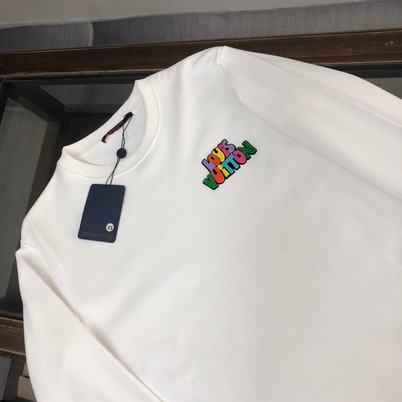 Close-up detail shot of Louis Vuitton luxury clothing with signature branding