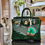 Side view of understated structured handbag